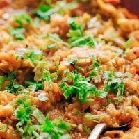 V4. Baingan Bharta · Roasted eggplant cooked with onion and spices.