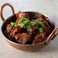 02. Goat Karahi · A classic karahi dish of goat cooked with onions, tomatoes, garlic and selected spices.