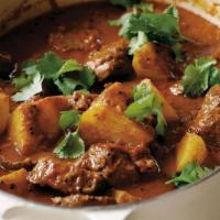 07. Lamb Vindaloo · Traditionally is a spicy hot dish made with lamb and potatoes, vinegar and lots of hot red c...