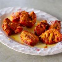 T2. Chichen Boti Kabab · Boneless chicken breast marinated in spices and mustard, cooked in clay oven.