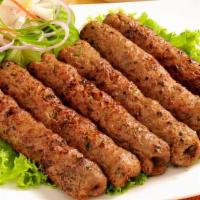 T4. Chicken Seekh Kabab (2) · Ground beef blended with rare selection of delicious herbs and spices. Barbecued on skewer a...