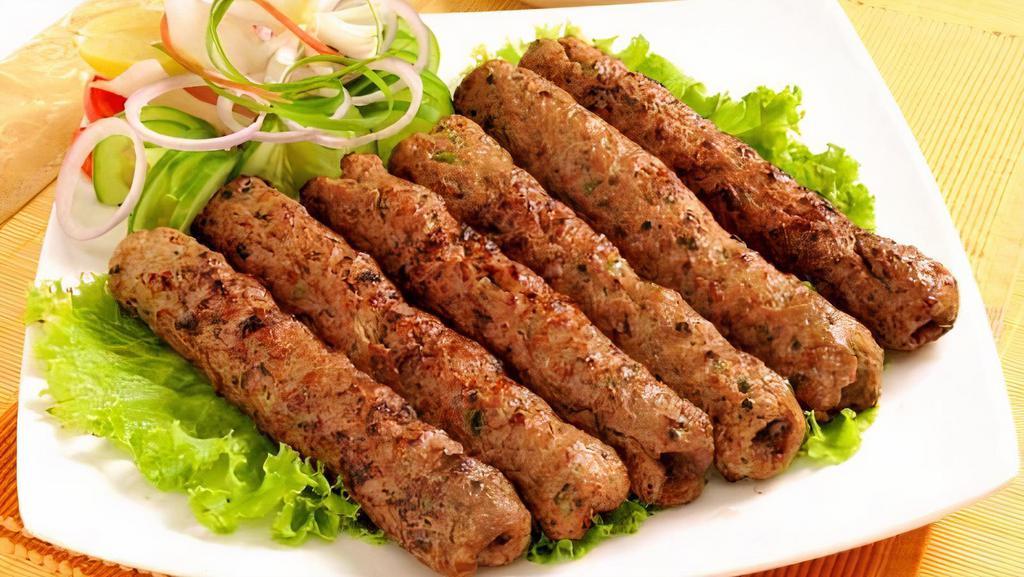 T4. Chicken Seekh Kabab (2) · Ground beef blended with rare selection of delicious herbs and spices. Barbecued on skewer and tenderly cooked in clay oven.