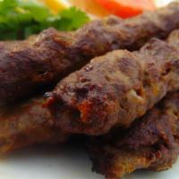T5. Beef Seekh Kabab (2) · Ground beef blended with rare selection of delicious herbs and spices. Barbecued on skewer a...