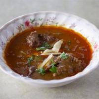 C12. Nihari · A very special traditional boneless beef shank cooked with selected spices.