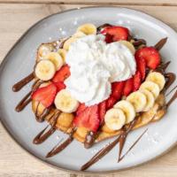 The Nutella Works Waffle · One single bubble waffle topped with Nutella, bananas, strawberries and topped with powdered...