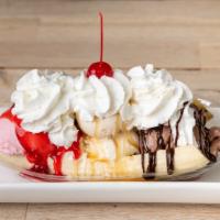Original Banana Split · sliced banana topped with a scoop each of vanilla, chocolate and strawberry ice cream, caram...
