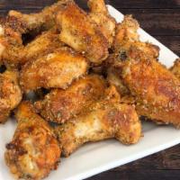 Garlic Parmesan Wings · Baked, all-natural chicken tossed in garlic Parmesan seasoning. Served with a side of ranch ...