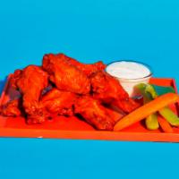 Buffalo Wings · Six crispy buffalo wings served with blue cheese and celery.