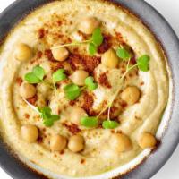 Hummus with Pita · Creamy garbanzo beans, garlic, tahini and lemon juice.