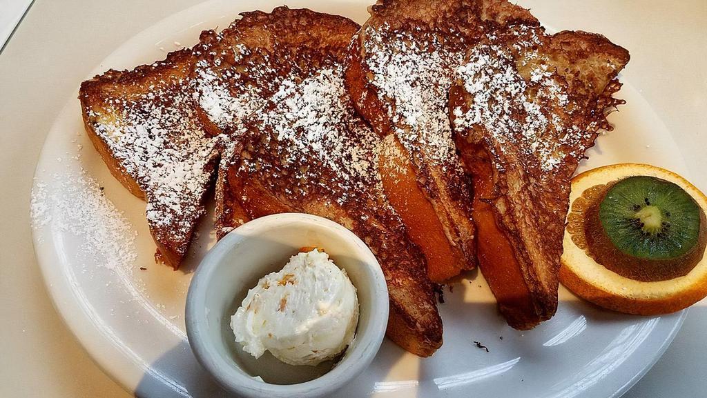 Brioche French Toast · In a coffee-kahlua batter, served with orange butter.