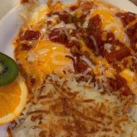 Huevos Rancheros · Two eggs cooked to order topped with homemade salsa and jack and cheddar cheeses, served on ...