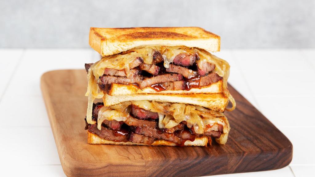 Brisket Melt · Griddled sandwich with brisket, melty pepperjack cheese, barbecue sauce, on your choice of bread.