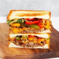 Philly Steak Melt · Griddled sandwich with chopped steak, melted American cheese, caramelized onions, sauteed be...