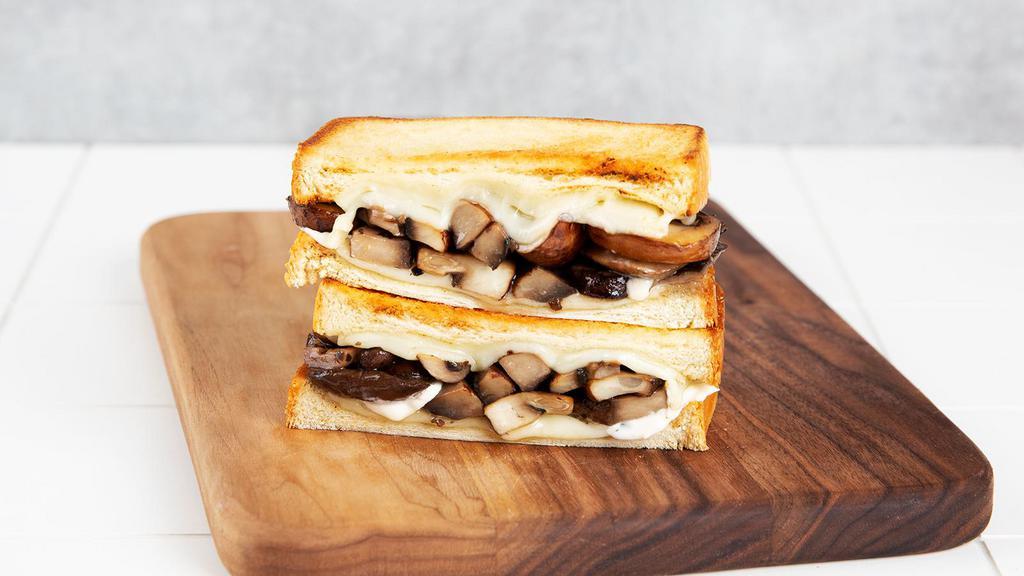 Mushroom Melt · Griddled sandwich with mushrooms, melty provolone and Swiss cheese, mayonnaise, and your choice of bread.