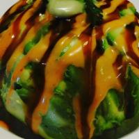 Monkey Brain · Spicy tuna mixed with seaweed salad and wrapped in avocado.