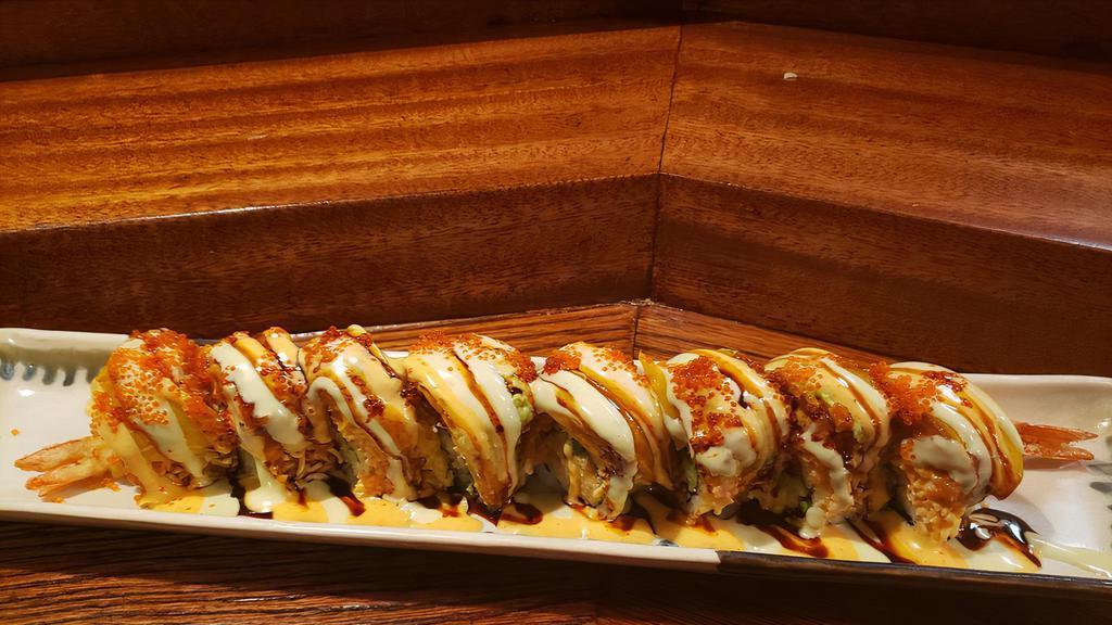 Mango Dragon (8pcs) · Our specialty. In: shrimp tempura and cucumber, out: spicy salmon, spicy imitation crab meat, mango, avocado and tobiko, sauce: spicy mayo, wasabi mayo and unagi sauce.