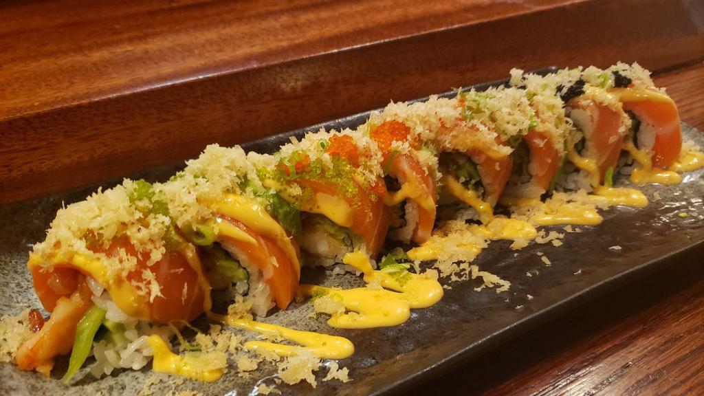 Sunshine (8pcs) · New. In: shrimp tempura and spicy hamachi, out: fresh sake, avocado, green onion, three different flavored tobiko and tempura flakes, sauce: house-made special orange sauce.