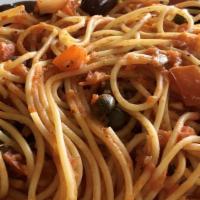 Spaghetti Puttanesca · Spaghetti pasta, capers, kalamata olives, basil, fresh tomato sauce, anchovies on request.