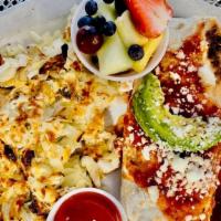 Ranchero Breakfast Burrito · Flour tortilla filled with scrambled eggs, onions, tomatoes, bell peppers and avocado, toppe...