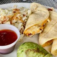 Bacon & Eggs Tacos · 3 corn tortillas filled with bacon and scrambled eggs, topped with cheddar cheese and garnis...