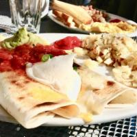 South of the Border · 2 flour tortillas filled with 3 scrambled eggs, chorizo, mushrooms, onions, green chilies, a...