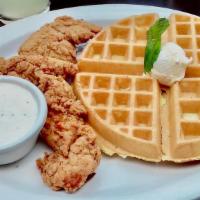 Chicken and Waffle · Crispy fried and seasoned chicken tenderloins over a waffle. Served with your choice bone in...