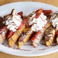Strawberry Nutella Banana French Toast · 3 thick slices of Texas toast dipped in an egg batter with vanilla, cream, and cinnamon. Top...