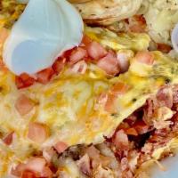 Meat Omelet · Ham, bacon, sausage, mushrooms, onions, diced tomatoes, cheddar-jack cheese, sour cream and ...