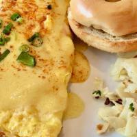 Crab Omelet · Crab, scallions and jack cheese, topped with hollandaise sauce.
