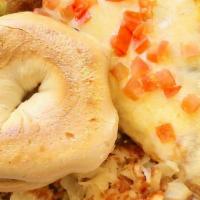 Shrimp Omelet · Bay shrimp, scallions, avocado, jack cheese, diced tomatoes and sautéed mushrooms. Served wi...