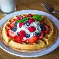 GF Triple Berry Waffle · Seasonal berries with whipped cream and powdered sugar.