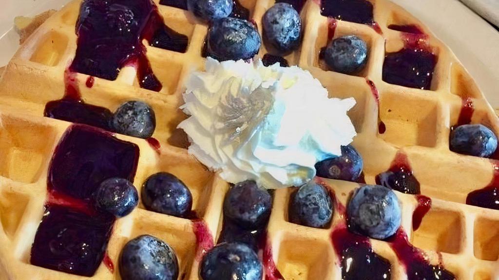 GF BlueBerry Waffle · Topped with blueberries in a blueberry glaze with fresh whipped cream.
