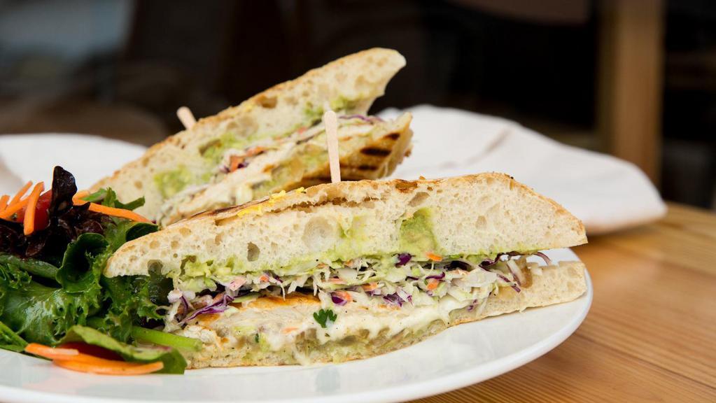 The California · grilled chicken, guacamole, swiss cheese, coleslaw and grilled onions