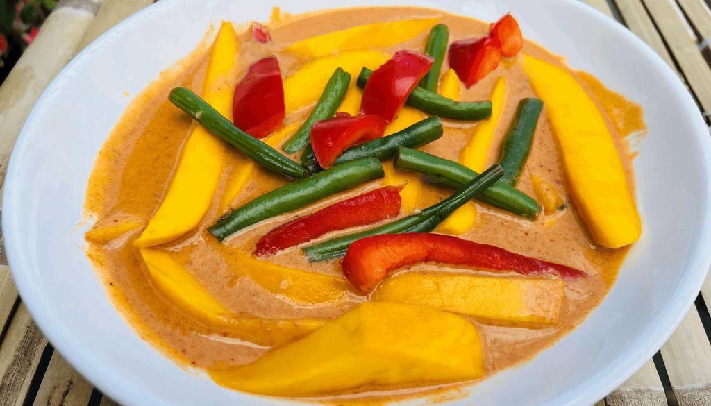 Thai Mango Curry* · Aromatic Thai coconut curry with fresh mango and your choice of curry and protein. (Vegan and Gluten-free)