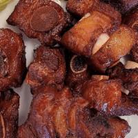 Phumsak (pork spare ribs) · Pork spare ribs marinated in grandma recipes from northern of Thailand and deep fried and se...
