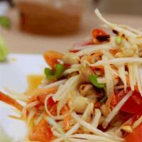 Som Tum (Papaya Salad) · The most popular Thai salad. Shred papaya,carrot, tomato, green bean mixed in tamarind lime ...