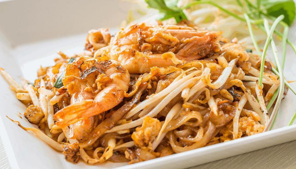 Pad Thai · Thin rice noodles, egg, bean sprouts, chive and your choice of chicken or pork or veggies or tofu. Lime & ground peanut on the side.