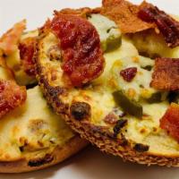 Jalapeno Popper · Our home made Jalapeno Popper spread with sliced jalapenos, jack cheese and bacon bits.