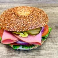 Ham Sandwich · Bagel with cold cut  ham. Comes with mayo, mustard, lettuce, tomato, onion, cucumbers, pickl...