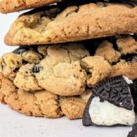 Cookies & Cream (Single) · A warm, generous cookie filled with crunchy Oreo chunks and melty pools of white chocolate!