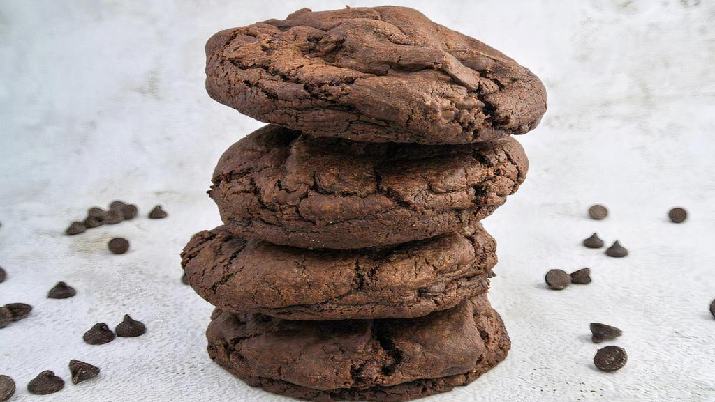 Triple Choc Cookie · Soft, giant chocolate cookie filled with a medley of melty pools of dark chocolate chunks and semi-sweet chocolate chips.