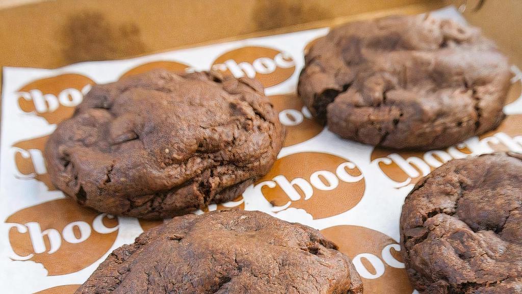 Triple Choc Cookie Box · A box of four soft, giant chocolate cookies filled with a medley of melty pools of dark chocolate chunks and semi-sweet chocolate chips. Chocolate perfection.