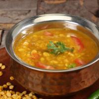 (V) Channa Dal · Split garbanzo beans cooked with indian spices and herbs. Vegan.