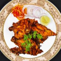 Tandoori Garlic · Chicken breast marinated with garlic paste & indian spices & cooked in clay oven.