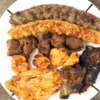 Mix Grill · Chicken tikka kabab, boti kabab, tandoori chicken prawns and fish.
