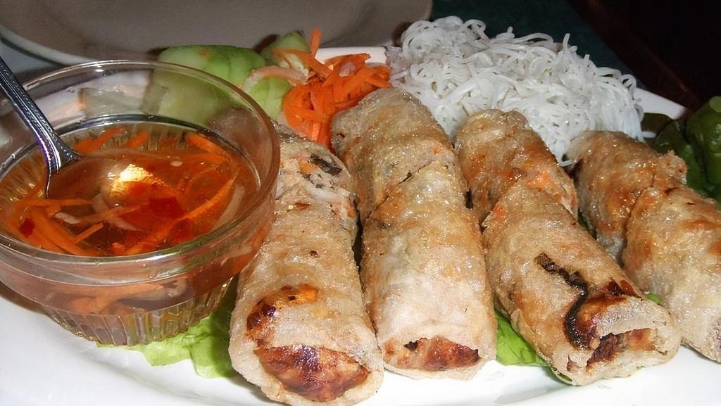 01. Imperial Rolls · House favorite deep fried rice paper rolls with pork, taro root, carrots.