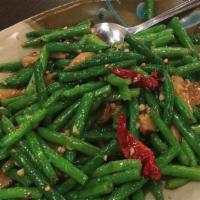 103. Spicy Green Beans · Hot. Sautéed tender green bean, mushroom, garlic, chilies.