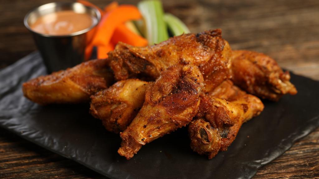 Cajun · 8 Cajun dry rub wings (mild heat), served with carrots & celery and a choice of blue cheese, classic ranch, or Sriracha ranch for dipping