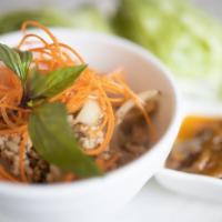 Basil Lettuce Wraps · Minced chicken saute with Thai basil, onion & water. Served with Cups of Iceberg lettuce and...