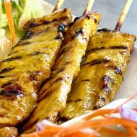 Chicken Satay · Served with Thai peanut sauce, cucumber and house salad.